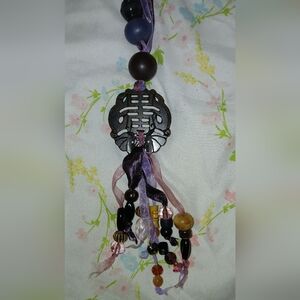 Elegant Beaded Necklace with Intricate Pendant